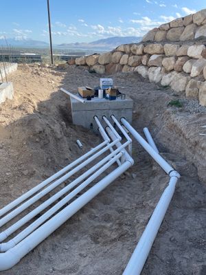 Splash pad lines — one pipe per spray nozzle, all headed out to the pad